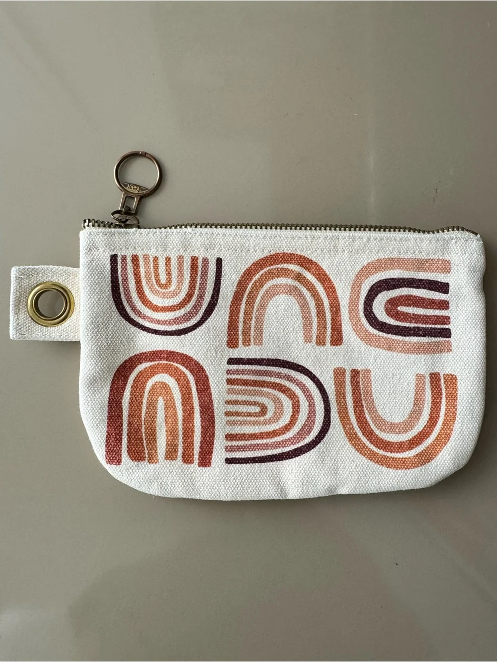 Danica Studio canvas zip pouch with terracotta rainbow screen-print design